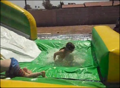 12' wate rslide and kids playing