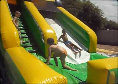 water slide and kids having fun on it